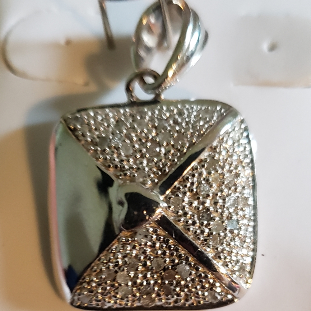 Brand new silver and diamond pendant